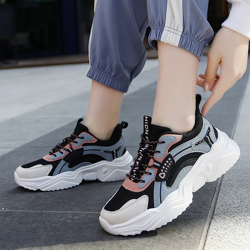 Women's white and black mesh casual sports shoes with thick sole, buckle closure, and round toe.