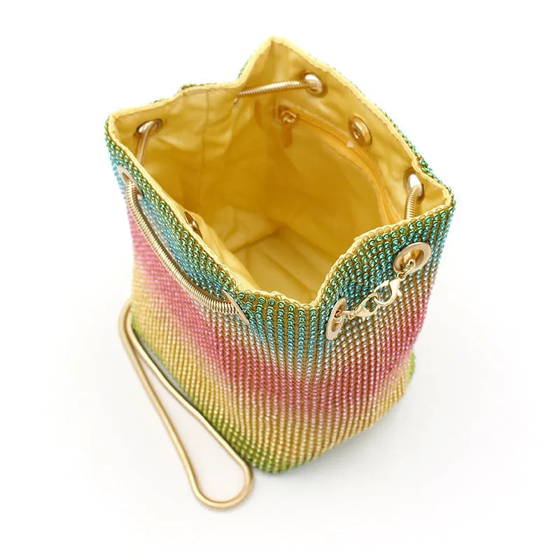 Colourful rainbow pattern rhinestone bucket bag with a soft texture.