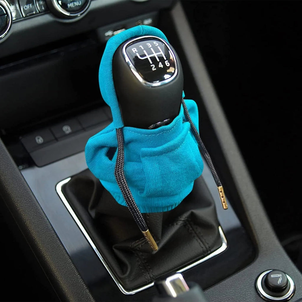 Blue cloth car gear shift knob hoodie cover shown on a gear lever.