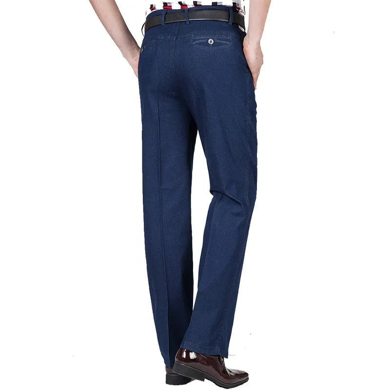 Men's high waist loose fit blue denim jeans on a neutral background