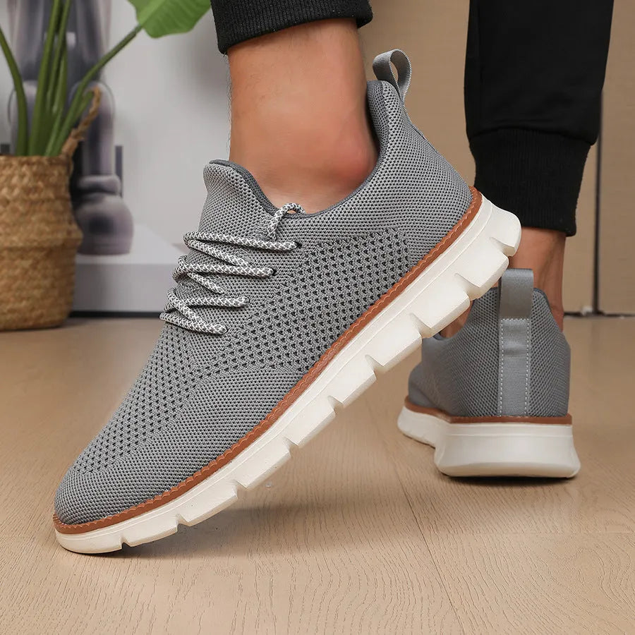 Men's casual sneaker with mesh upper in black or grey colour with round toe design