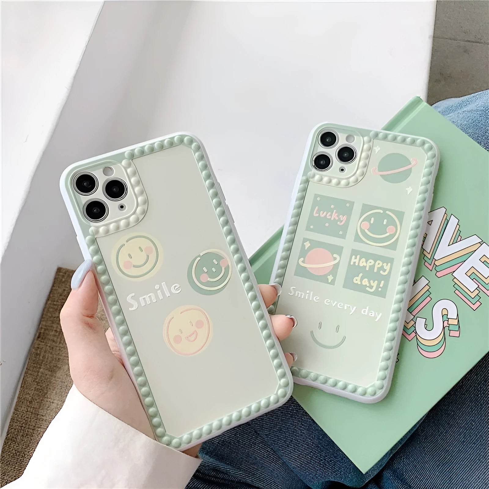 Green iPhone case with geometric smiley face and white polka dot design on a soft rubber TPU back cover.