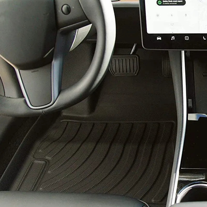 Heavy-duty rubber floor mats for Tesla cars with TPE footrest section.