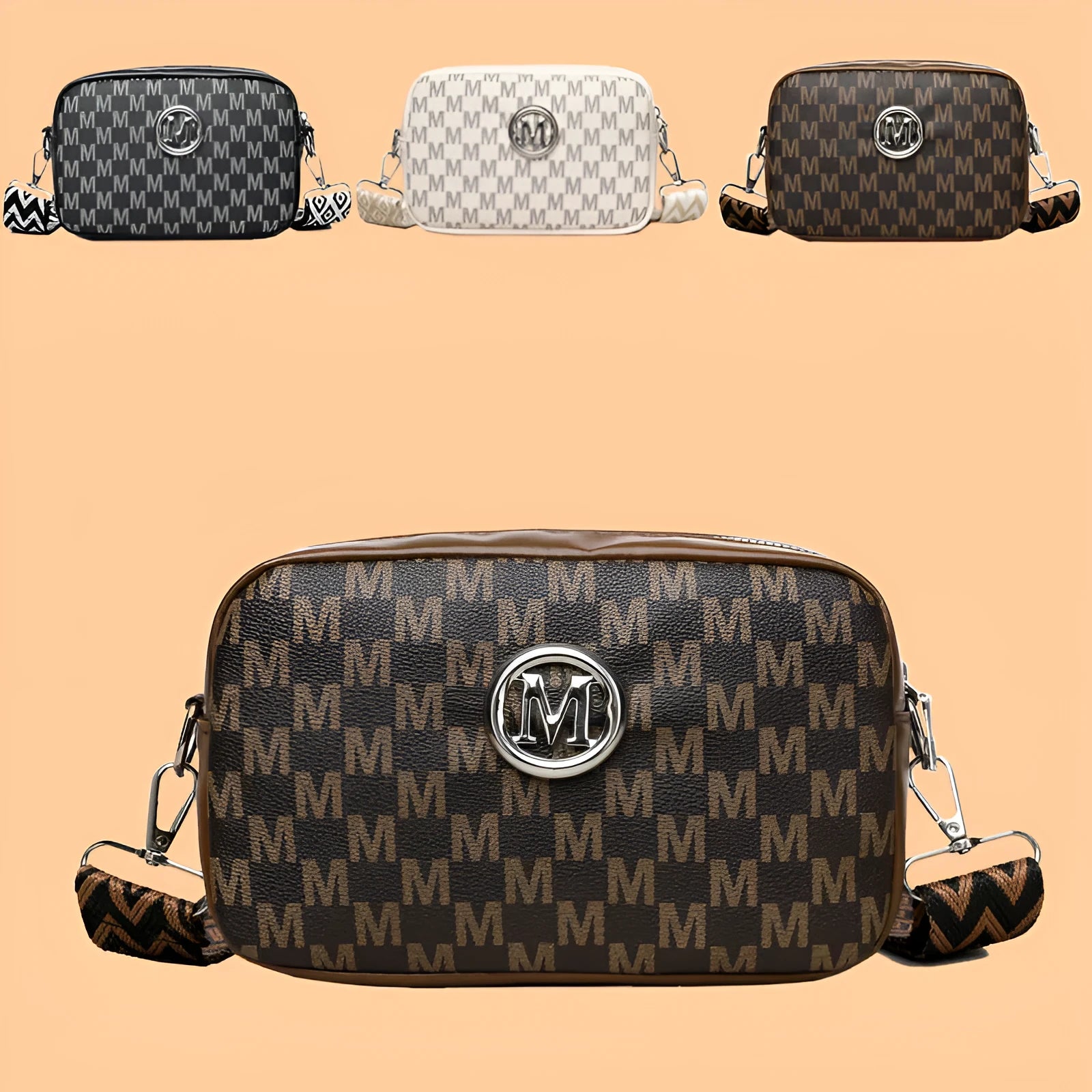 Black crossbody bag with wide strap and a three-dimensional front pocket.