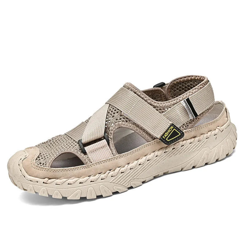Men's grey casual sandals with a mesh lining, genuine leather upper, and an elastic band toe holder on a rubber sole.