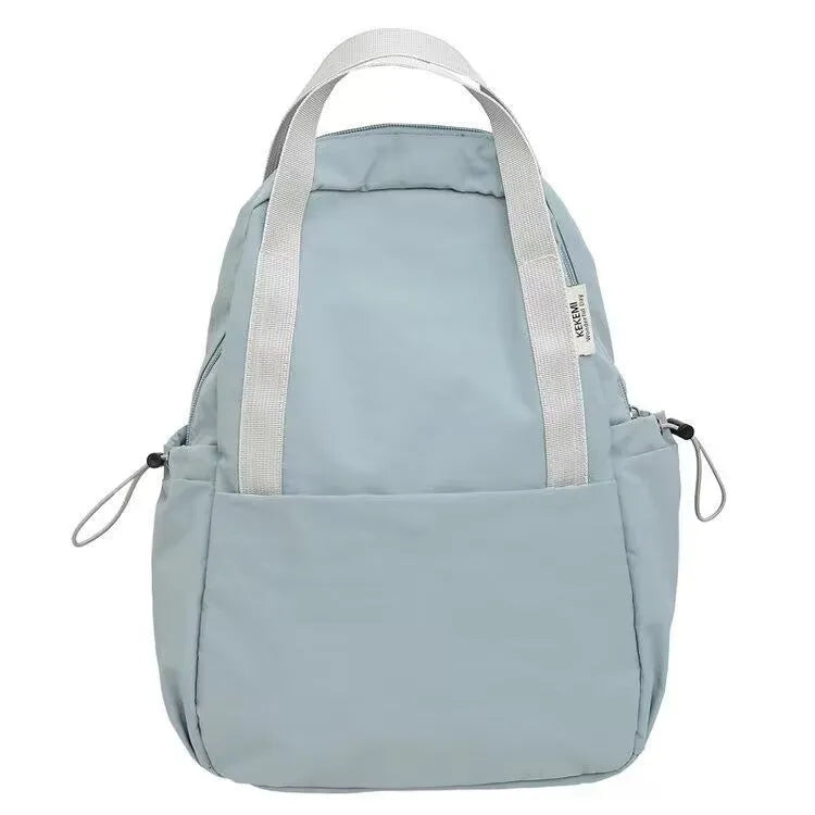 Solid colour nylon backpack with curved shoulder straps and a lock closure.