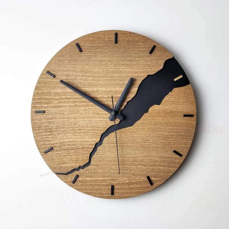Modern wooden wall clock with a white crack design on a coloured background.