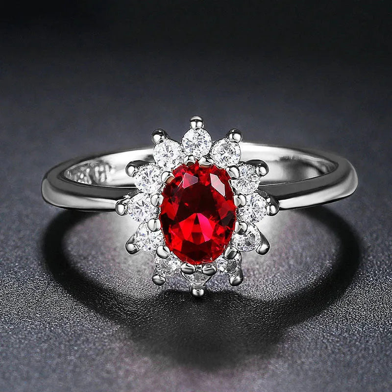 Blue moissanite copper flower ring with electroplated finish shown on finger