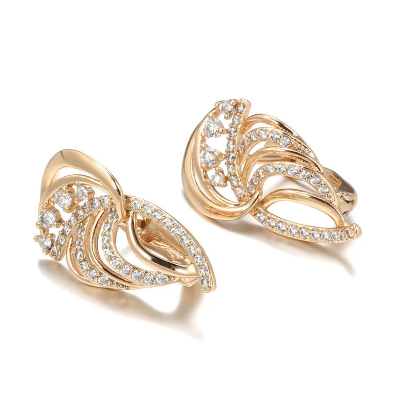 Gold-plated copper ear clips with geometric wing design and micro-inlaid zircon gemstones