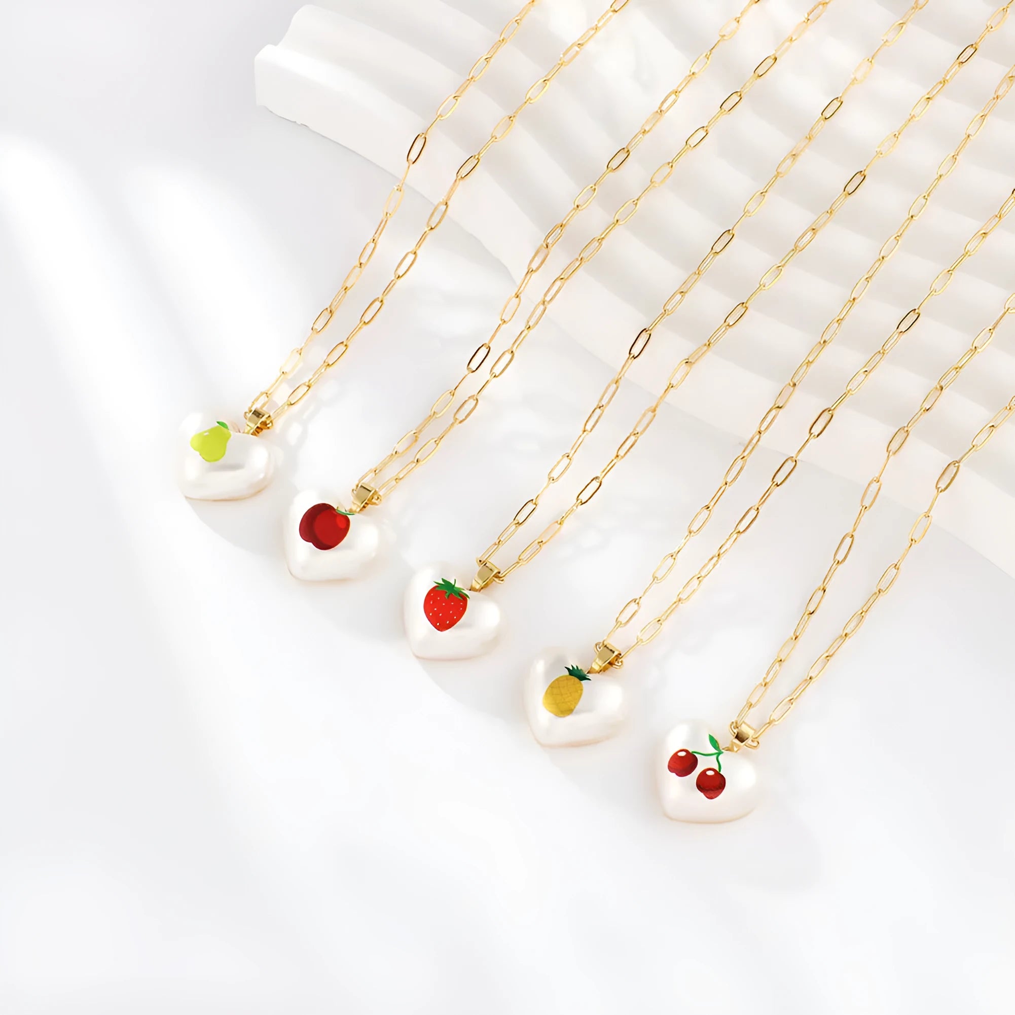 Adjustable geometric chain necklace with a choice of strawberry, pineapple, apple, pear or cherry fruit charm pendant.