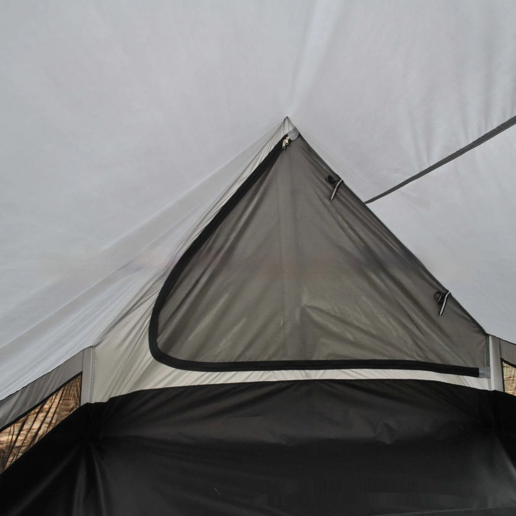 Brown A-line pole-free cabin tent pitched with hiking canes showing spacious interior dimensions