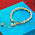 Natural Hetian Jade women's bracelet with pearl pendant and gold electroplated Chinese style design