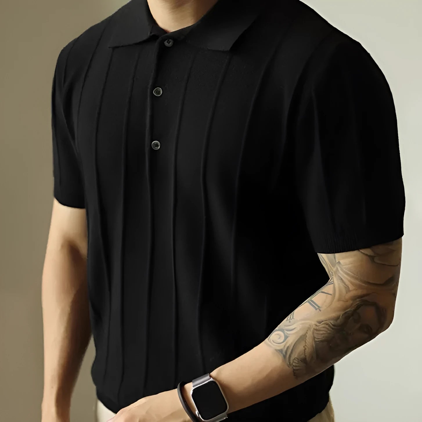 A man's loose-fit solid colour polyester pullover t-shirt on a hanger, shown in black and white colour options.