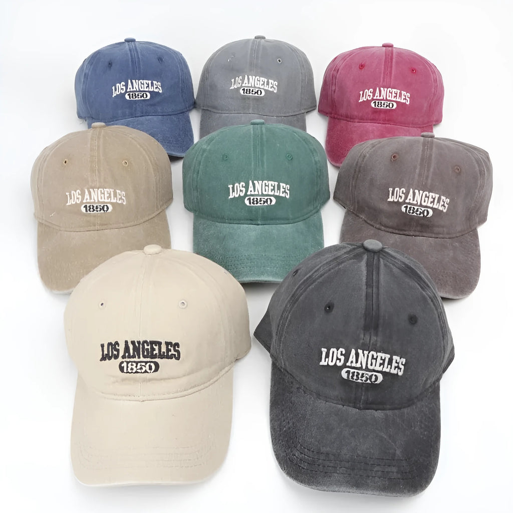 Retro distressed baseball cap with embroidered letters on the front, shown in a beige colour.