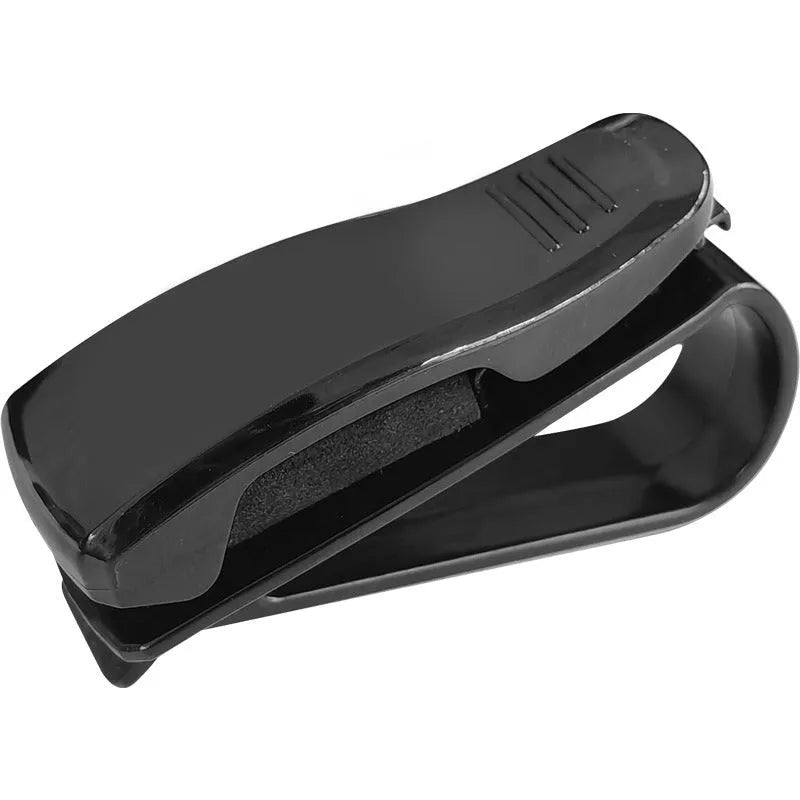 Black plastic car sun visor clip for holding sunglasses, tickets and ID cards.