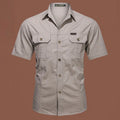 Men's short sleeve cotton shirt in army green colour, showing loose fit and cardigan style on a hanger.