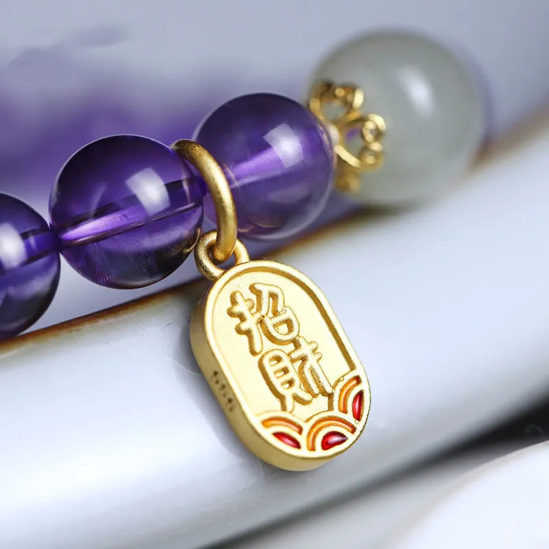 Amethyst purple crystal bracelet with 8mm geometry-shaped beads on wrist