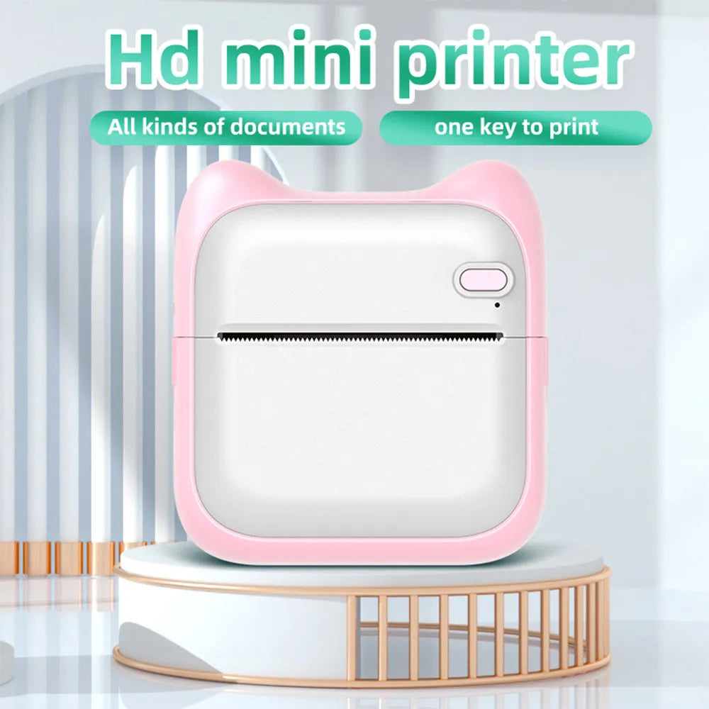 Mini pocket Bluetooth thermal printer in pink with USB charging cable