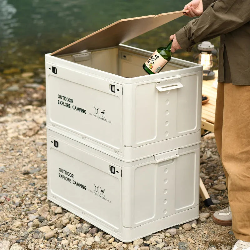 Large green plastic storage box with a wooden lid, showing foldable sides.