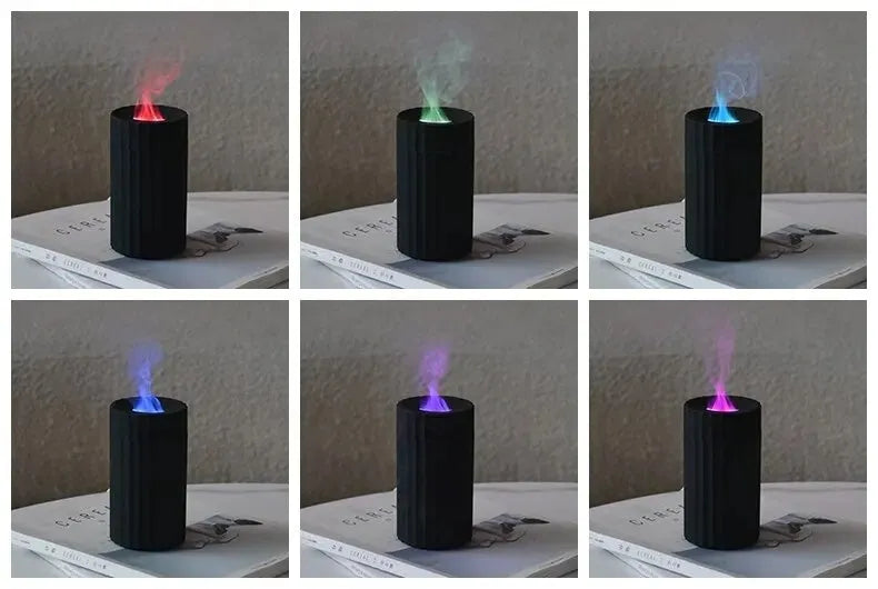 Black and white essential oil diffuser and humidifier with a simulated LED flame effect on a table.