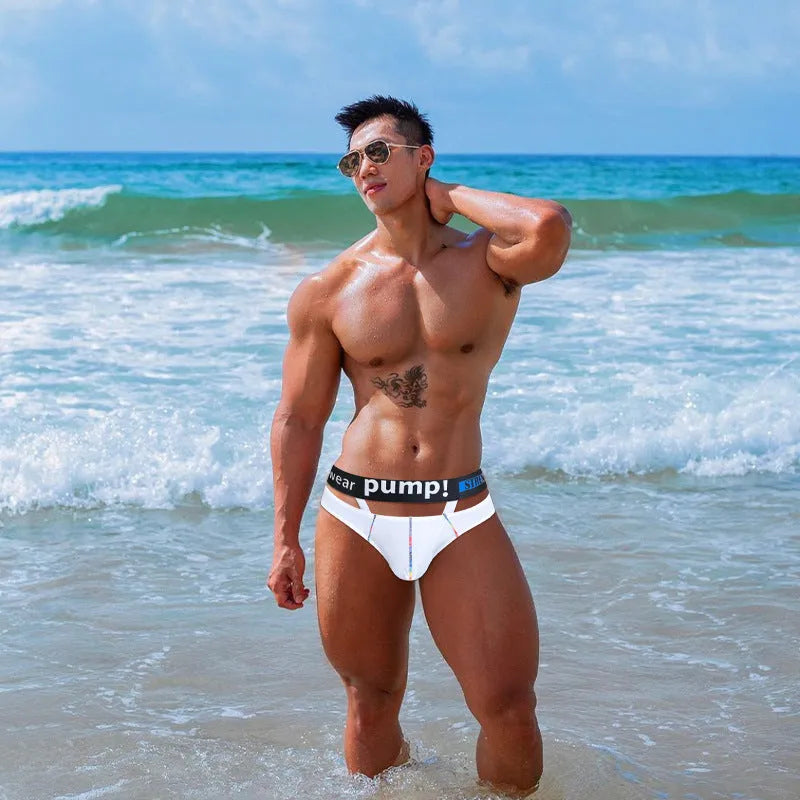 A pair of solid black men's low-rise modal briefs laid flat on a white background.