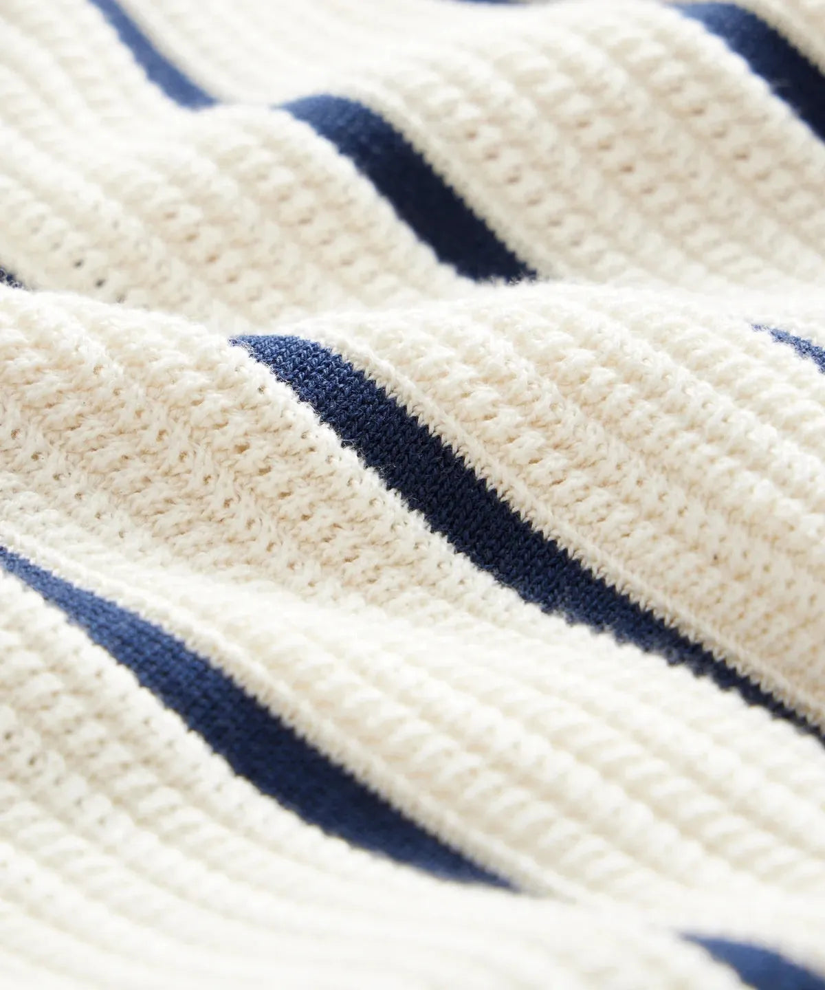 Men's white asymmetric striped knitted short sleeve top with a lapel collar