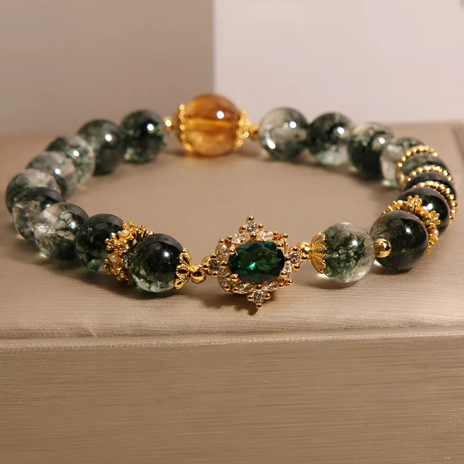Gold rutilated quartz women's bracelet with green phantom quartz, ruby quartz beads and crystal accents