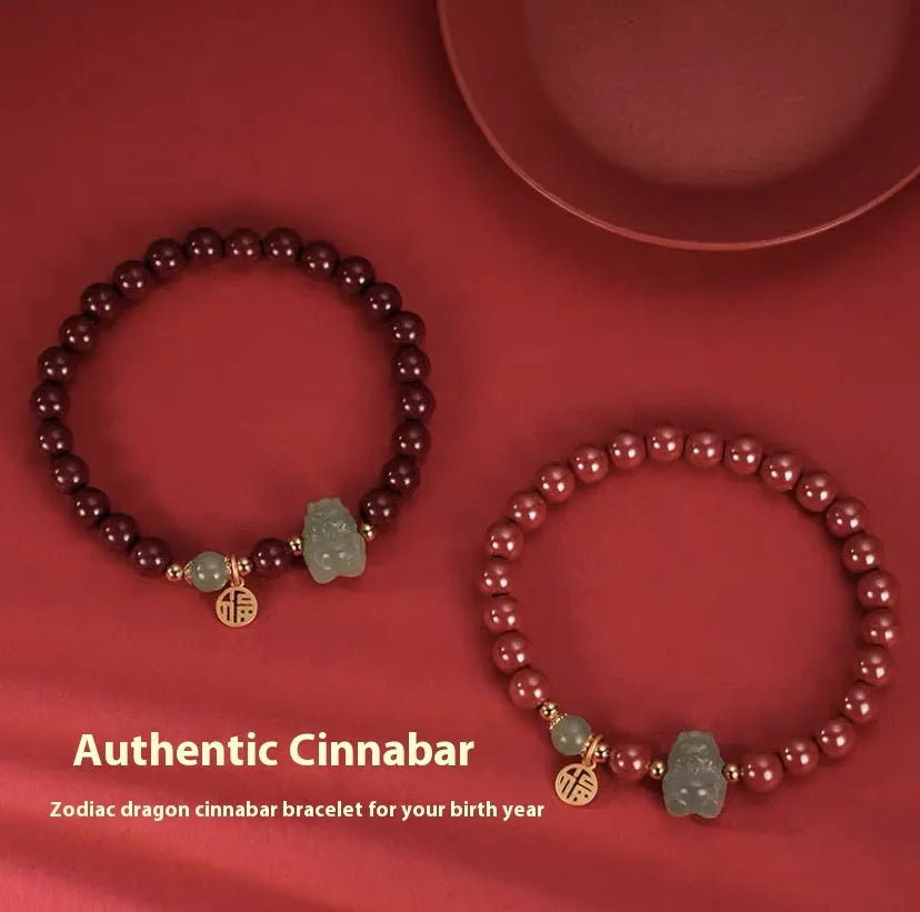Hetian Jade bracelet with cinnabar accents showing 8mm beads and animal zodiac modelling
