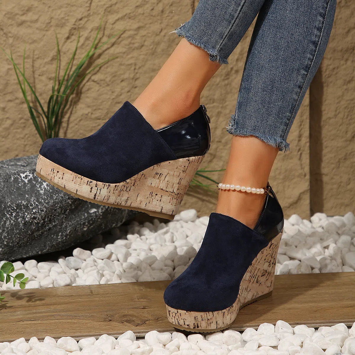 Women's wedge heels in black suede and leather patchwork with round toe and back zipper closure.