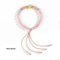 Hand-woven women's bracelet with natural crystal peach blossom charm and adjustable rope strap