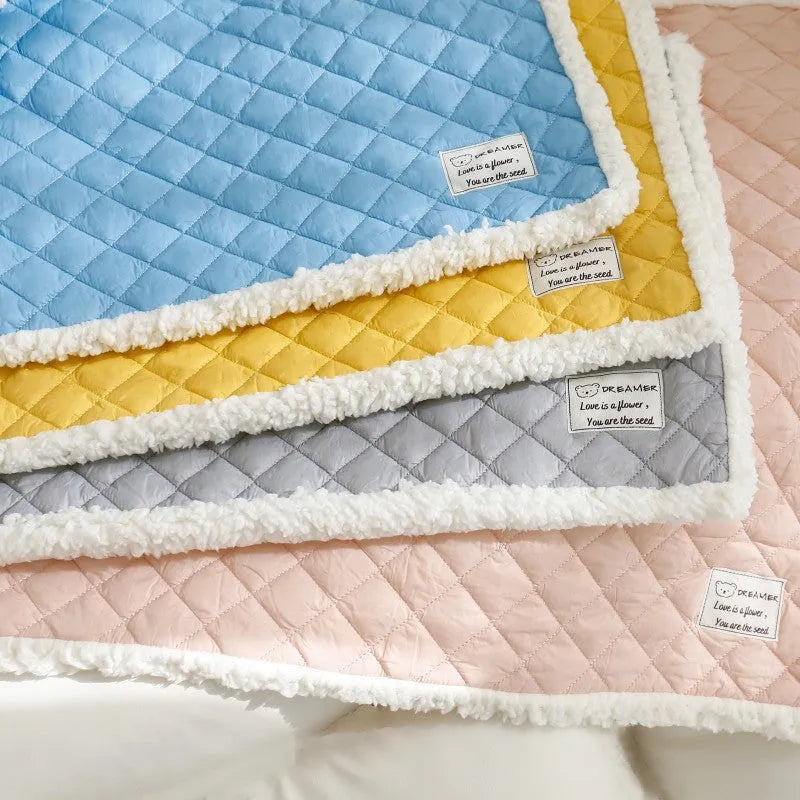 Quilted blue cloth pet blanket for cats shown in a large 80x60cm size.