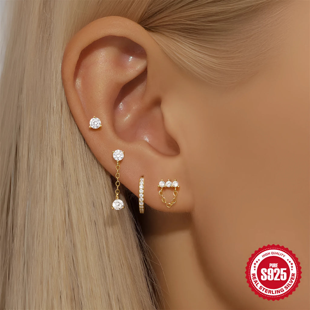 A pair of S925 sterling silver earrings with a geometric clover petal design and an electroplated gold finish.