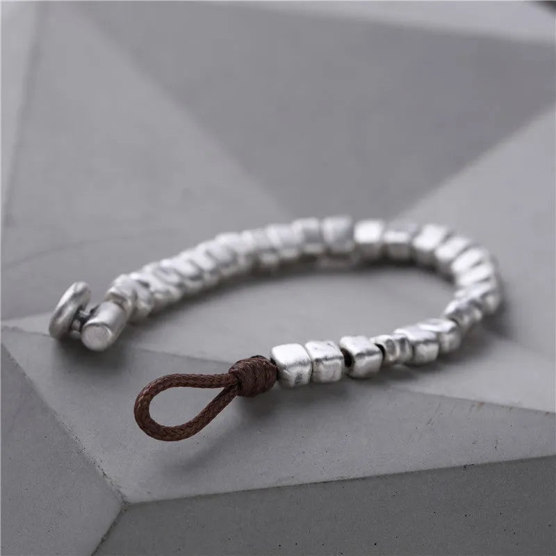 Handmade wooden women's bracelet with silver-coloured irregular square design on elastic band