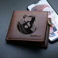 Leather men's wallet with zipper closure shown individually packaged as gift accessory