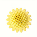 Yellow rubber sunflower dog chew toy with green stem, shown on a white background.