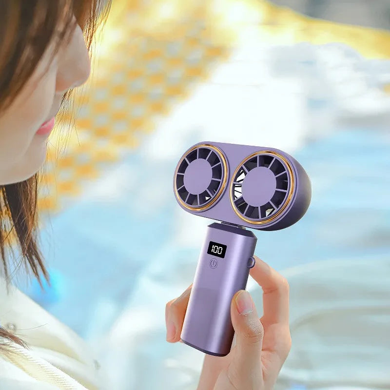 USB handheld mini fan with folding design and digital display screen showing battery level