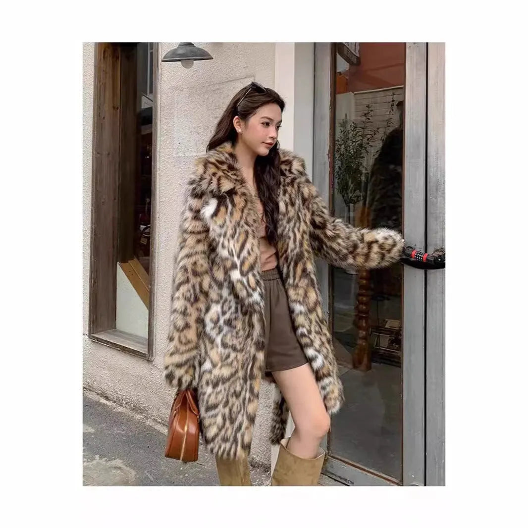 Faux fur coat with detachable collar in street fashion style showing long length and practical pockets