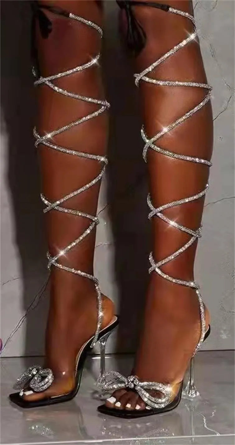 Plus size women's strappy high-heel sandals with rhinestone Roman straps and a square toe.