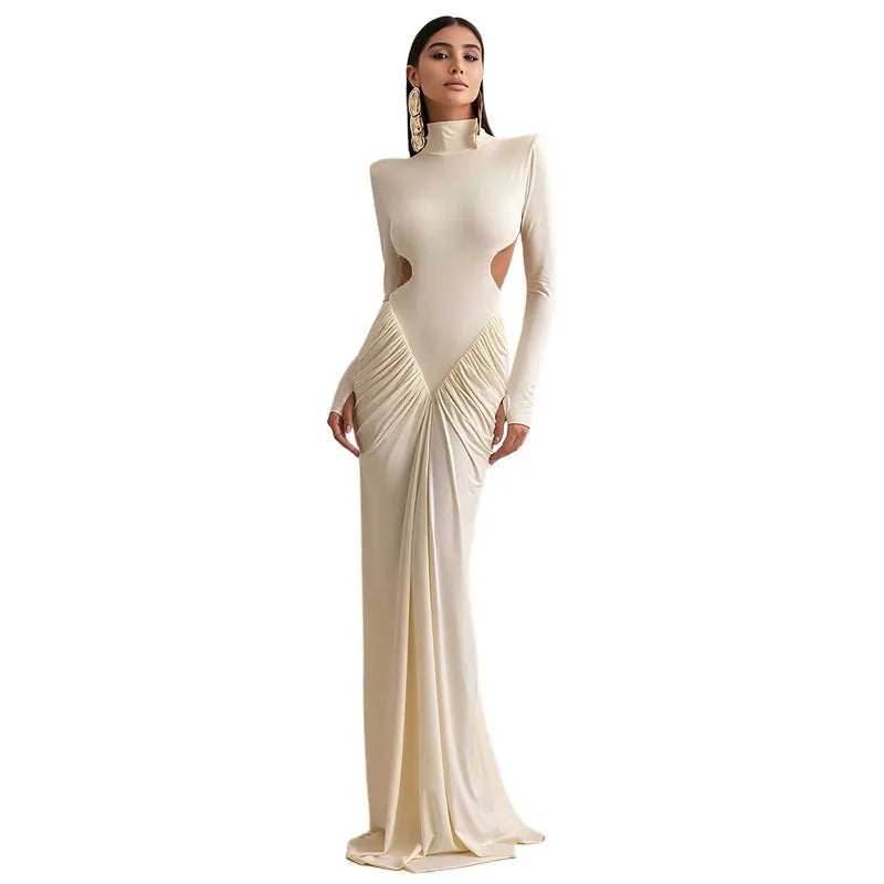 Long sleeve high collar slim fit dress with pleated backless detail in light apricot colour.