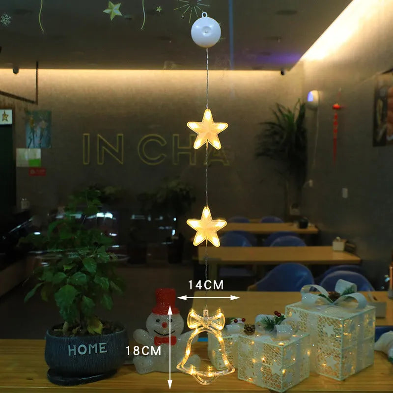 Set of three battery-powered LED Christmas pendant lights with suction cups, showing star, tree, and deer designs.