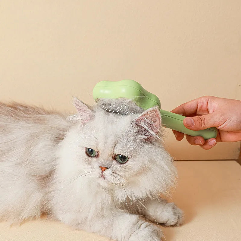 Magic Wand self-cleaning pet comb with stainless steel teeth in green colour