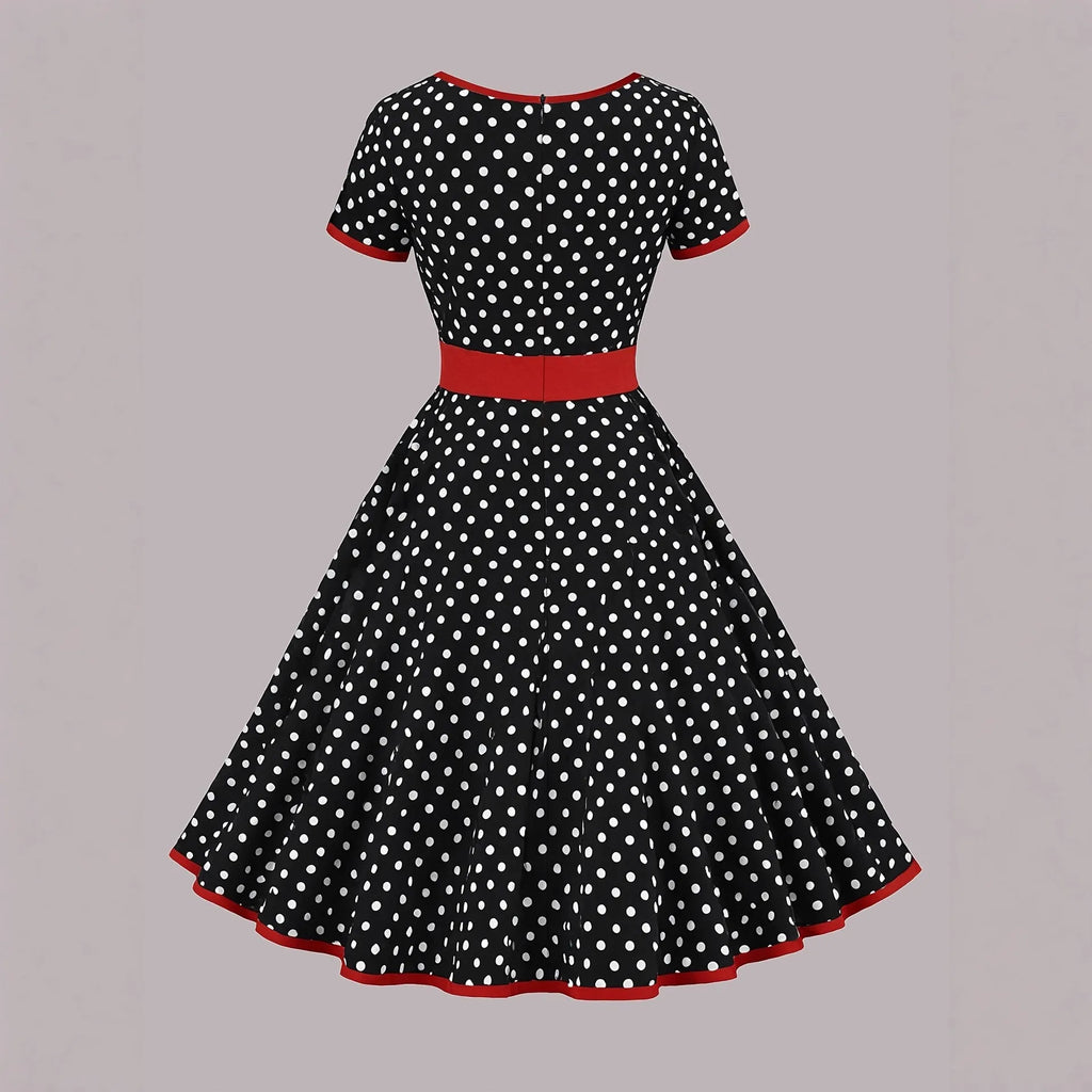 Multicolour polka dot dress with a square collar, short sleeves, pleated skirt, and a front zipper.