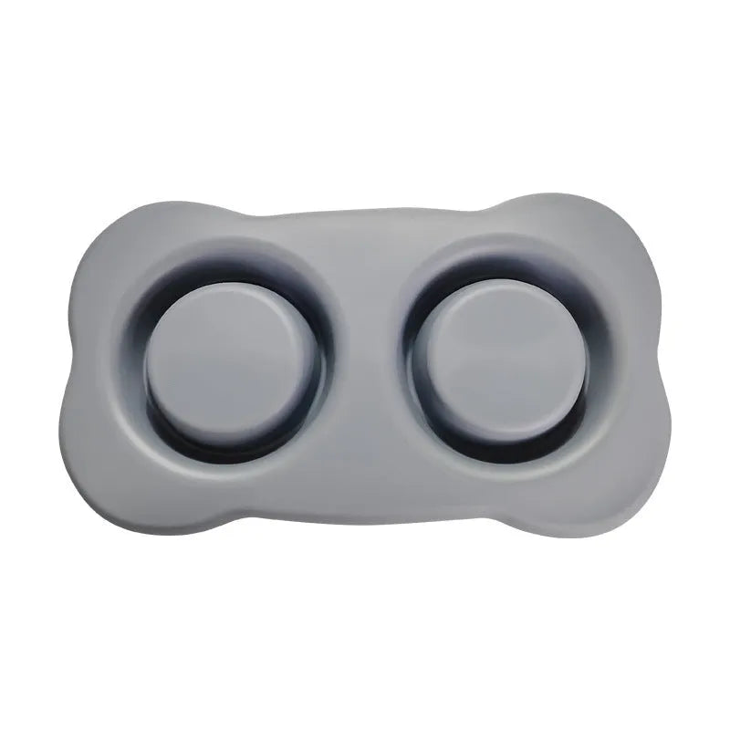 Large silicone pet feeding mat with two bowl slots in blue colour on hard floor