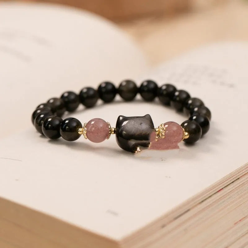 Black obsidian 8mm bead bracelet with silver kitty charms on adjustable closure