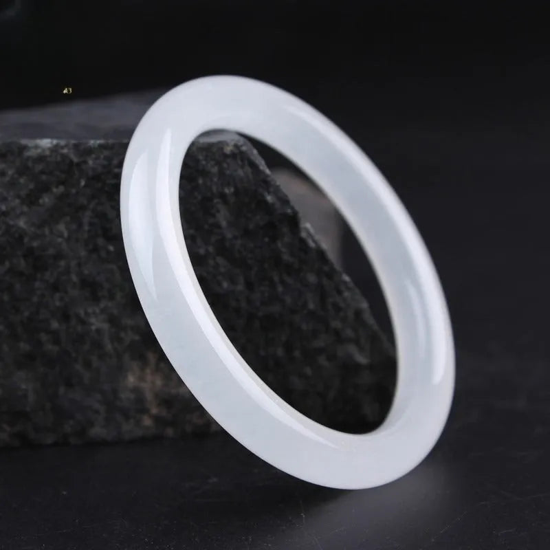 Gao Bing ice-like white moonlight jade bracelet showing flat rod and round rod style options on a wrist.