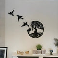 Black decorative iron wind chime wall art with a modern simple design, shown with its hanging strap.