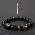 Handmade obsidian bracelet with red and yellow tiger eye beads in circle design