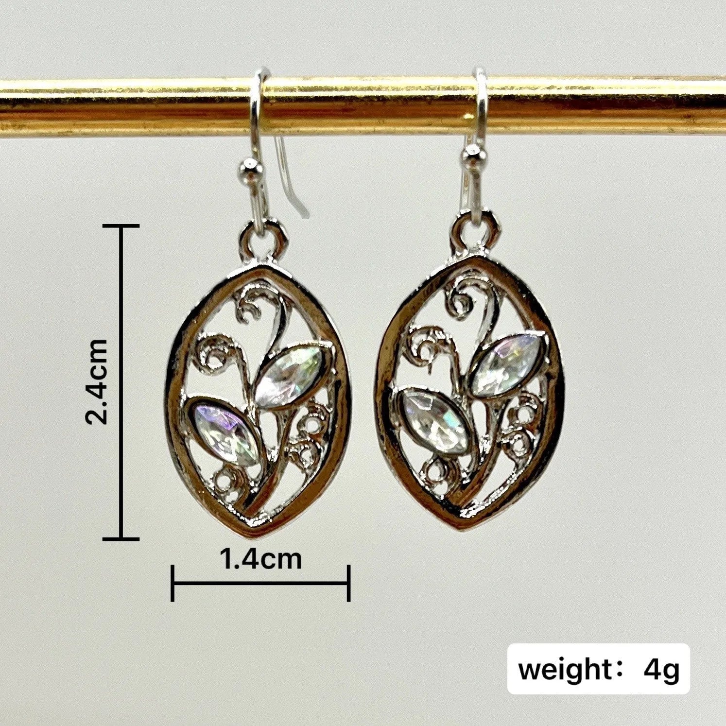 Silver leaf-shaped women's earrings with embedded colourful moonstone gemstones