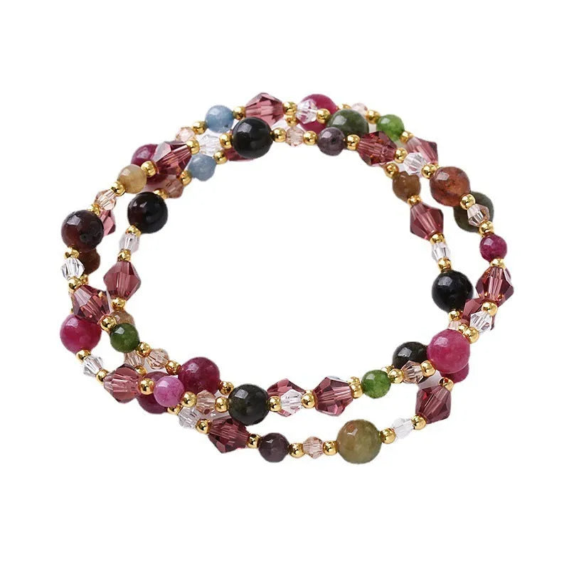 Colourful three-ring crystal bracelet for women with amethyst, strawberry quartz, and tourmaline beads on an adjustable rope.