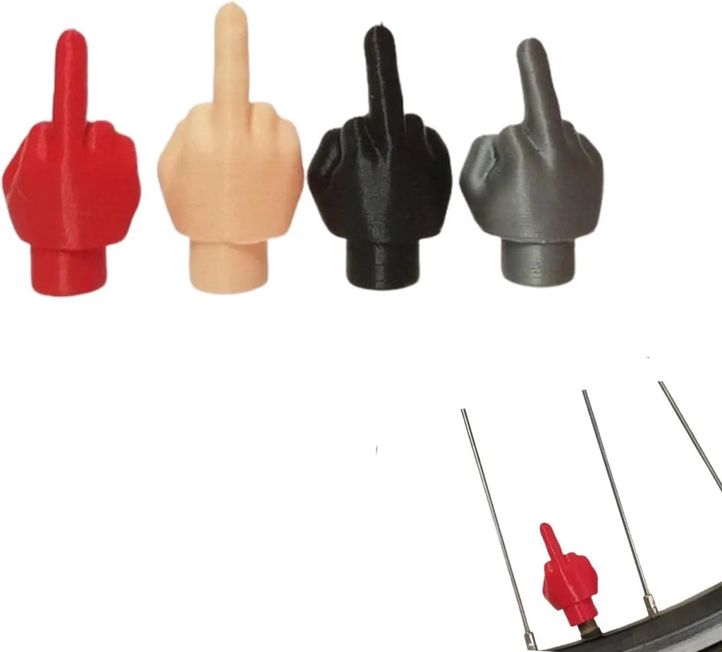 Four latex car tyre valve caps - two black and two skin colour pieces
